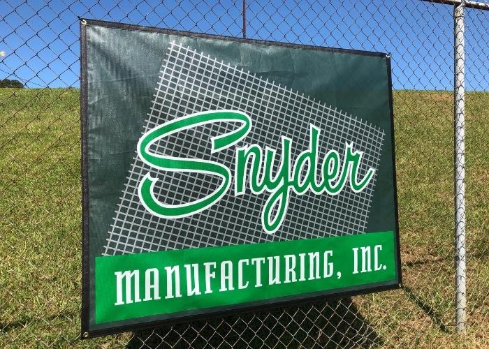 Banner with Snyder Manufacturing logo on it made with Snyder MasterMesh